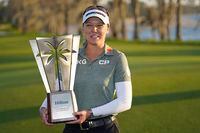Brooke Henderson holds up the championship trophy after winning the LPGA Hilton Grand Vacations Tournament of Champions, Sunday, Jan. 22, 2023, in Orlando, Fla. Brooke Henderson loves breaking records and this week she's got a dubious one hanging over her head.THE CANADIAN PRESS/AP/John Raoux