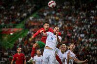 Portugal's forward Cristiano Ronaldo (L) vies for a header with Czech Republic's forward Vaclav Jurecka (R) during the UEFA Nations League, league A group 2 football match between Portugal and Czech Republic at the Jose Alvalade stadium in Lisbon on June 9, 2022. (Photo by PATRICIA DE MELO MOREIRA / AFP) (Photo by PATRICIA DE MELO MOREIRA/AFP via Getty Images)
