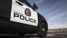 Police vehicles at Calgary Police Service headquarters in Calgary on Thursday, April 9, 2020. Calgary police say a man has been taken to hospital in life-threatening condition after a shooting on a bus in the city's downtown. THE CANADIAN PRESS/Jeff McIntosh