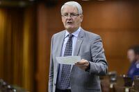 Transport Minister Marc Garneau stands during question period in the House of Commons on Parliament Hill amid the COVID-19 pandemic in Ottawa on Monday, May 25, 2020. The federal government has named a legal expert as senior adviser to Global Affairs Canada on the shooting down of a passenger jet in Iran that killed 176 people. THE CANADIAN PRESS/Sean Kilpatrick