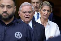 FILE — Sen. Bob Menendez and his wife, Nadine Menendez leave federal court, Sept. 27, 2023, in New York. The newest charge requiring Menendez to come to court, Monday, Oct. 23, 2023, returned last week in a rewritten indictment, accuses the Democrat of conspiring to violate the Foreign Agents Registration Act, which requires people to register with the U.S. government if they act as "an agent of a foreign principal." It's a never-before-used World War II-era charge that carries a potential prison term of up to two years. (AP Photo/Seth Wenig, File)