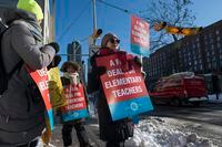 Teachers march outside Market Lane Junior and Senior Public School on Jan 20 2020. Elementary school teachers across Toronto are out on strike as well as several other boards.  