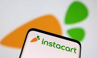 Smartphone with displayed Instacart logo is seen in this illustration taken March 25, 2022. REUTERS/Dado Ruvic/Illustration