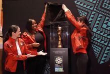 Former Canadian internationals, from left to right, Diana Matheson, Robyn Gayle and Jonelle Filigno unveil the FIFA Women’s World Cup trophy, in Toronto, Wednesday, April 19, 2023, as part of its worldwide tour in advance of this summer's tournament in Australia and New Zealand. THE CANADIAN PRESS/Neil Davidson