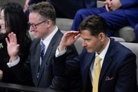 Canadians Michael Kovrig and Michael Spavor react as they are seated before an address from U.S. President Joe Biden in the Canadian House of Commons on Parliament Hill, in Ottawa, Canada, Mach 24, 2023. Andrew Harnik/Pool via REUTERS