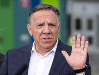 Coalition Avenir du Quebec leader Francois Legault speaks to the media while campaigning Aug. 31, 2022  in Montreal.