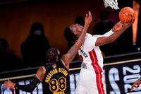 Los Angeles Lakers forward Markieff Morris, left, fouls Miami Heat forward Bam Adebayo during the second half in Game 5 of basketball's NBA Finals Friday, Oct. 9, 2020, in Lake Buena Vista, Fla.