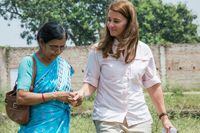 Melinda Gates with Sudha Varghese during her walking tour of Kothwa village in Danapur, Bihar, India, on April 18, 2015.