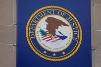 FILE PHOTO: The crest of the United States Department of Justice (DOJ) is seen at their headquarters in Washington, D.C., U.S., May 10, 2021. REUTERS/Andrew Kelly/File Photo
