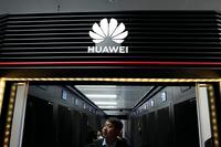 A worker walks in the a Huawei server room at the Hongliulin Coal Mine near the city of Shenmu in northwestern China's Shaanxi province on Tuesday, April 25, 2023. Chinese tech giant Huawei reported Friday that its revenue edged up 0.8% from a year earlier in the first three months of 2023 and the company was profitable. (AP Photo/Ng Han Guan)
