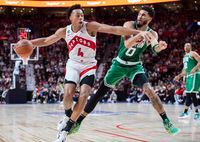 Toronto Raptors Scottie Barnes (4) gets by Boston Celtics Jayson Tatum during second half NBA pre-season basketball action in Montreal, Friday, Oct. 14, 2022. THE CANADIAN PRESS/Graham Hughes