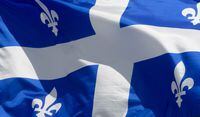 Quebec's provincial flag flies on a flagpole in Ottawa on June 30, 2020. Quebec's chief coroner is ordering a public inquest into the 2019 killing of a Montreal woman and her two children. THE CANADIAN PRESS/Adrian Wyld