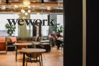 FILE PHOTO: A WeWork logo is seen at a WeWork office in San Francisco, California, U.S. September 30, 2019.  REUTERS/Kate Munsch/File Photo