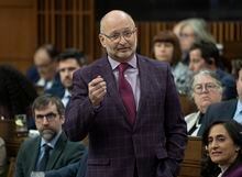 Minister of Justice and Attorney General of Canada David Lametti rises during Question Period, in Ottawa, Wednesday, March 29, 2023. Prime Minister Justin Trudeau is accusing Prairie premiers of distorting the words of his justice minister after comments David Lametti made at a meeting of Assembly of First Nations chiefs last week. THE CANADIAN PRESS/Adrian Wyld