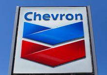 FILE PHOTO: A Chevron gas station sign is seen in Del Mar, California, April 25, 2013. Chevron will report earnings on April 26. REUTERS/Mike Blake/File Photo/File Photo