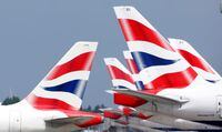 FILE PHOTO: British Airways tail fins are pictured at Heathrow Airport in London, Britain, May 17, 2021. REUTERS/John Sibley