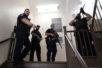 U.S. Capitol Police officers clear a stairwell in the Dirksen Senate Office Building next to the Russell Senate Office Building, on Aug. 2 on Capitol Hill in Washington.