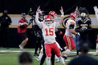 Kansas City Chiefs quarterback Patrick Mahomes (15) reacts after throwing a touchdown pass in the first half of an NFL football game against the New Orleans Saints in New Orleans, Sunday, Dec. 20, 2020.