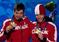 Brian McKeever of Canada, right, and his brother and guide Robin McKeever celebrate their gold medal win in the men's 10 km Classic cross country visually impaired race during the 2010 Winter Paralympic Games in Whistler, B.C., Thursday, March 18, 2010. Robin McKeever has been named head coach of Canada's cross-country ski team following 12 years coaching the country's decorated Para Nordic program. THE CANADIAN PRESS/Jonathan Hayward