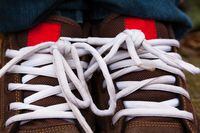 Shoelaces of teenager sneaker