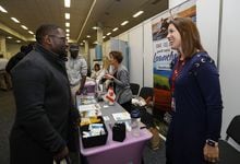 Healthcare Job Fair, RDS, Dublin 22/10/2022Rebecca Gill, Director of Health Recruitment and Retention PEI talks to Olu Aoko, originally from Nigeria, a gastroenterologist who has worked in Ireland for the last 11 years.Lorraine O'Sullivan/The Globe and Mail