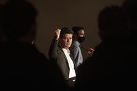 Unifor President Jerry Dias gestures to members of the bargaining committee after announcing a three-year labour agreement with the Ford Motor Company, at a news conference in Toronto, Tuesday, Sept. 22, 2020. Dias, the head of Canada's largest private-sector union, is retiring amid ongoing health issues. THE CANADIAN PRESS/Chris Young