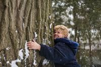 Edith George wraps her arms around a red oak tree, that's approximately 250 to 300 years old, in North York, Ont. on Friday, February 7, 2020.  Tijana Martin/ The Globe and Mail