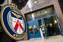 The Toronto Police Services emblem is photographed during a press conference at TPS headquarters, in Toronto on Tuesday, May 17, 2022.&nbsp;Police say one person is dead and two others have been taken to hospital after a shooting in a parking lot at a east-end Toronto mall. THE CANADIAN PRESS/Christopher Katsarov