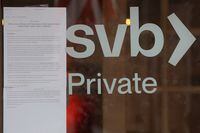 FILE PHOTO: A press release from the Federal Deposit Insurance Corporation (FDIC) is taped to the door of a branch of Silicon Valley Bank in Wellesley, Massachusetts, U.S., March 13, 2023. REUTERS/Brian Snyder/File Photo
