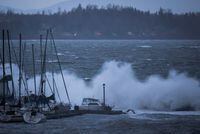 Boats are battered by waves at the end of the White Rock Pier during a windstorm, in White Rock, B.C., on Dec. 20, 2018.