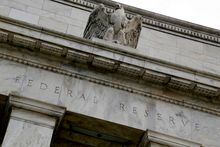 FILE PHOTO: An eagle tops the U.S. Federal Reserve building's facade in Washington, July 31, 2013. REUTERS/Jonathan Ernst