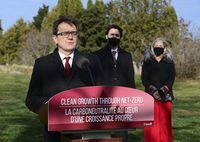 Minister of Environment and Climate Change Jonathan Wilkinson, left to right, Prime Minister Justin Trudeau and Minister of Infrastructure and Communities Catherine McKenna hold a press conference at the Ornamental Gardens in Ottawa on Thursday, Nov. 19, 2020. THE CANADIAN PRESS/Sean Kilpatrick