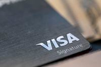 FILE This Aug. 11, 2019, file photo shows a Visa logo on a credit card in New Orleans. Payment processing giant Visa's profits rose 21% in the first three months of the year fueled by a large jump in spending on the company's namesake credit and debit card network. The San Francisco-based company reported Tuesday, April 26, 2022, that it earned $3.65 billion, or $1.70 a share, in its fiscal second quarter that ended March 31. (AP Photo/Jenny Kane, File)