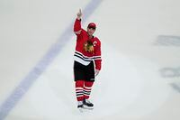 Chicago Blackhawks center Jonathan Toews waves to the crowed after the Flyers defeated the Chicago Blackhawks 5-4 in overtime in Toews' final NHL hockey game with the Blackhawks, Thursday, April 13, 2023, in Chicago. (AP Photo/Nam Y. Huh)