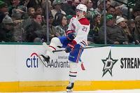 Montreal Canadiens defenseman Kaiden Guhle (21) celebrates a goal during the first period an NHL hockey game against the Dallas Stars in Dallas, Tuesday, Jan. 2, 2024. (AP Photo/LM Otero)