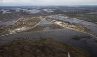 Peguis First Nation with surrounded with Fisher River flood water north of Winnipeg, Sunday, May 15, 2022. Manitoba is expanding a mandatory evacuation and closure area in Whiteshell Provincial Park in the province's east due to flooding. THE CANADIAN PRESS/John Woods/POOL