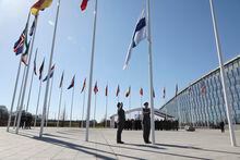 Military personnel raise the flag of Finland during a flag raising ceremony on the sidelines of a NATO foreign ministers meeting at NATO headquarters in Brussels, Tuesday, April 4, 2023. Finland joined the NATO military alliance on Tuesday, dealing a major blow to Russia with a historic realignment of the continent triggered by Moscow's invasion of Ukraine. (AP Photo/Geert Vanden Wijngaert)