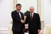 Russian President Vladimir Putin shakes hands with Chinese President Xi Jinping during a meeting at the Kremlin in Moscow, Russia, March 20, 2023. Sputnik/Sergei Karpukhin/Pool via REUTERS
