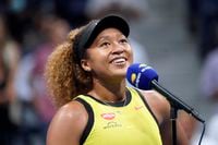 FILE - Naomi Osaka, of Japan, speaks to the crowd after beating Marie Bouzkova, of the Czech Republic, during the first round of the U.S. Open tennis championships in New York, in this Monday, Aug. 30, 2021, file photo. Osaka earned the Wilma Rudolph Courage Award for bringing awareness to social justice and mental health issues at the Annual Salute to Women in Sports on Wednesday night, Oct. 13, 2021, in New York. (AP Photo/Elise Amendola, File)