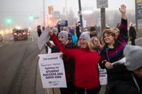 CUPE members and supporters join a demonstration outside the office of Parm Gill, Member of Provincial Parliament for the riding of Milton, in Milton, Ont., on Friday, Nov. 4, 2022. THE CANADIAN PRESS/Nick Iwanyshyn