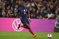 FILE - France's Paul Pogba runs with the ball during an international friendly soccer match between France and Cote d'Ivoire at the Velodrome stadium in Marseille, southern France, on  March 25, 2022. Pogba will miss the World Cup with ongoing knee problems. (AP Photo/Daniel Cole, File)
