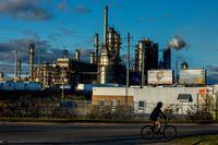 A cyclist passes by the Irving Oil Refinery in Saint John, NB, on October 27, 2017. Chris Donovan/The Globe and Mail 