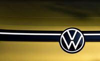 A VW logo is seen on a new Volkswagen (VW) ID.4 SUV electric car on display at the headquarters of German carmaker Volkswagen (VW) in Wolfsburg, northern Germany on March 26, 2021. - German auto giant Volkswagen said it is aiming to dominate the electric car market by 2025 as it accelerates the pace to catch up with US pioneer Tesla. Volkswagen sold 422,000 electrified vehicles in 2020. Of those, 230,000 were fully electric cars -- or three times more than in 2019 -- and the remainder petrol-electric hybrids. (Photo by Ronny Hartmann / AFP) (Photo by RONNY HARTMANN/AFP via Getty Images)