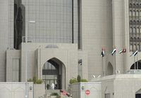 FILE PHOTO: A man enters the main branch of UAE Central Bank in Abu Dhabi, January 29, 2013.  REUTERS/Ben Job