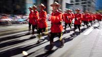 Members of the RCMP march during the Calgary Stampede parade in Calgary, Friday, July 6, 2012.THE CANADIAN PRESS/Jeff McIntosh