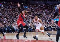 Jan 7, 2020; Toronto, Ontario, CAN; Toronto Raptors guard Kyle Lowry (7) controls a ball as Portland Trail Blazers forward Carmelo Anthony (00) defends during the fourth quarter at Scotiabank Arena. Mandatory Credit: Nick Turchiaro-USA TODAY Sports