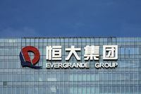 FILE PHOTO: The logo of China Evergrande Group is seen on the company's headquarters in Shenzhen, Guangdong province, China, Sept. 26, 2021. REUTERS/Aly Song/File Photo