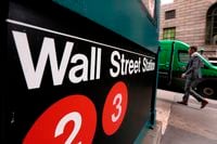 In this April 5, 2018, file photo, a sign for a Wall Street subway station is shown in New York. T