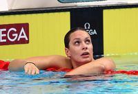 FILE PHOTO: Swimming - FINA World Championships - Budapest, Hungary - June 20, 2022 Canada's Penny Oleksiak reacts after qualifying during the women's 200m freestyle, heat 3 REUTERS/Antonio Bronic/File Photo