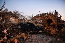 The remains of a house and cars are entangled in tree limbs in Rolling Fork, Mississippi, on March 25, 2023, after a tornado touched down in the area. - At least 25 people were killed by devastating tornadoes that ripped across the southern US state of Mississippi, tearing off roofs, smashing cars and flattening entire neighborhoods, with the region readying for more severe weather Sunday.
The powerful weather system, accompanied by thunderstorms and driving rain, cut a path of more than 100 miles (60 kilometers) across the state late March 24, 2023, slamming several towns along the way. (Photo by CHANDAN KHANNA / AFP) (Photo by CHANDAN KHANNA/AFP via Getty Images)